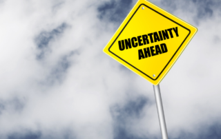 Sign that says "Uncertainty Ahead"